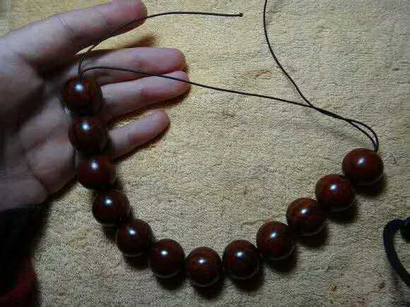 紫檀佛塔打结,小叶紫檀手串侧挂佛头打结方法