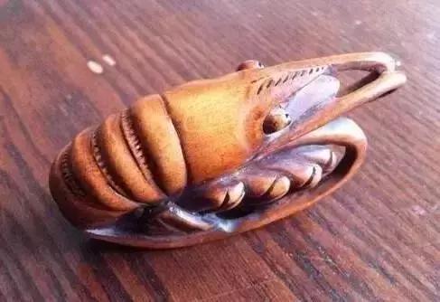 木雕兽头什么寓意,长颈鹿木雕婚礼摆件有什么寓意