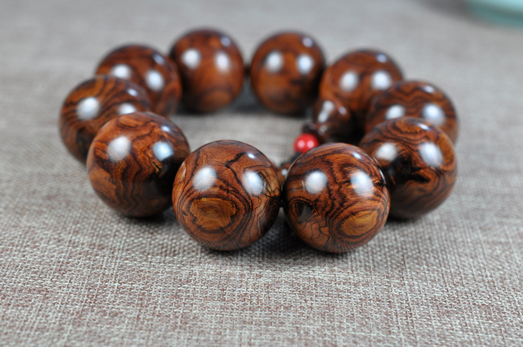 海南黄花梨芝麻点如何鉴别图,怎么鉴别海南黄花梨手串真假