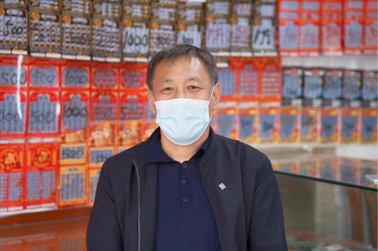 趣味标语挂满墙壁主力游戏成就区域销冠——记北京11116008号福彩站站主杨全强